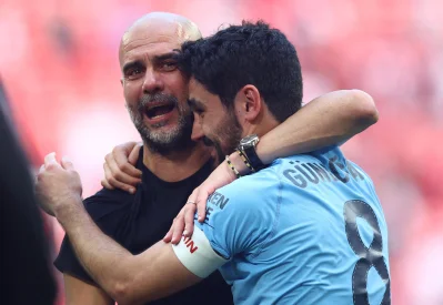 Ilkay-Gundogan-embraces-Pep-Guardiola-after-the-FA-Cup-final-2